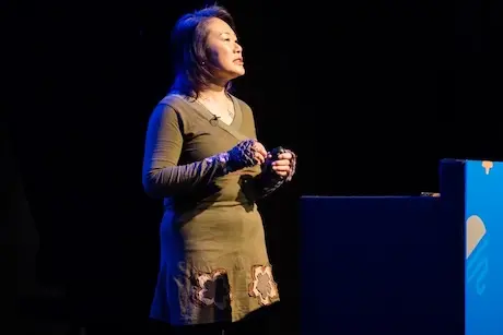 A woman giving a talk.